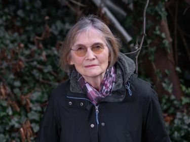 Author Danuta Reah, who has also written as Danuta Kot and Carla Banks, standing among undergrowth