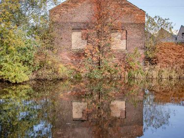 A derelict building alongside the canal towpath, Sheffield
